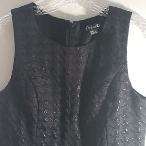 Black patterned sleeveless dress.